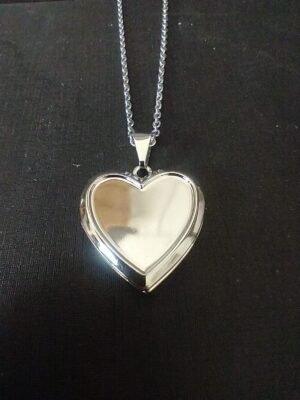 19.12 - RELICÁRIO DE AÇO CORAÇÃO COM RELEVO 2,3cm