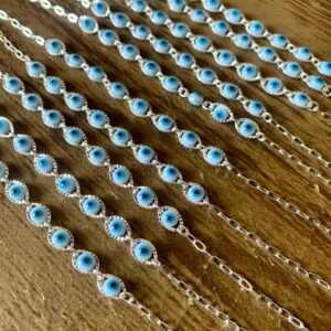 140.159 - PULSEIRA DE PRATA OLHOS GREGOS BRANCOS