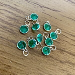 212.259 - PINGENTE DE PRATA PONTO DE LUZ EM REDONDO VERDE 0,3g