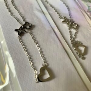 245.79 - 	COLAR DE AÇO TREVO CORAÇÃO VAZADOS