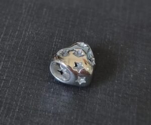 180.208 - BERLOQUE DE AÇO SEPARADOR ESTRELAS VAZADAS